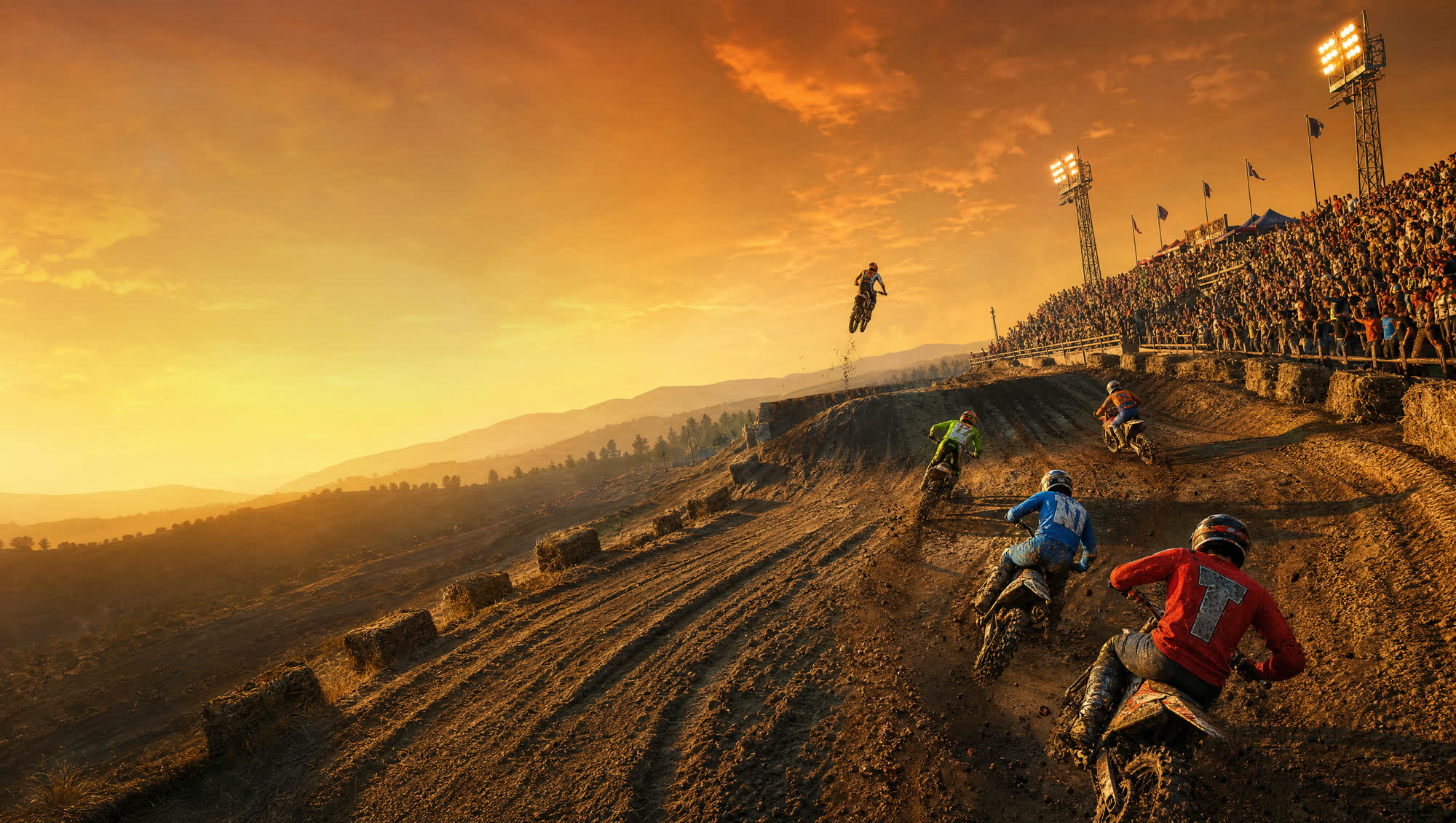 Dirtstorm MX riders battling through a berm